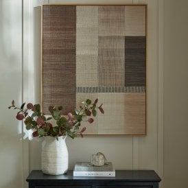Ivora hand-painted abstract framed canvas wall art displayed above a dark console table in a neutral interior.
