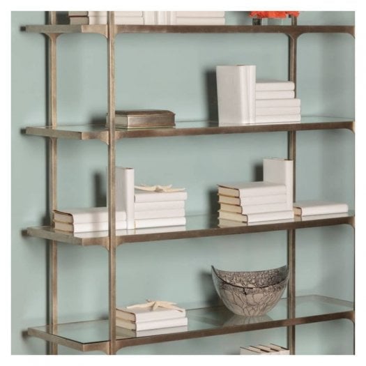 Luxury home accessories at Swanky Interiors featuring decorative bowls, bookends and stylish ornaments displayed on a contemporary shelving unit.