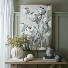 Poppy Heads hand-painted framed canvas wall art displayed above a wooden console table in a green interior.