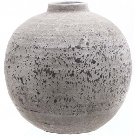 Tiber round distressed stone ceramic vase featuring a large spherical shape, short neck and textured grey finish with dark speckled detailing.